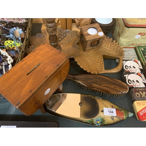 194 - A COLLECTION OF WOODEN AND TREEN ITEMS TO INCLUDE TRAYS, CANDLESTICKS, BOOK ENDS ETC