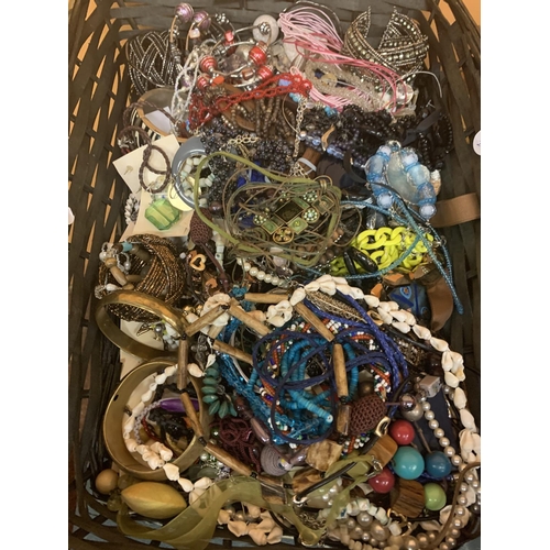 196 - A BASKET CONTAINING A LARGE QUANTITY OF COSTUME JEWELLERY