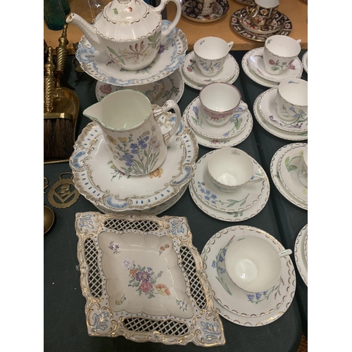 202 - A COLLECTION OF HAND PAINTED TRIOS, CAKE PLATES TEAPOT, JUG ETC