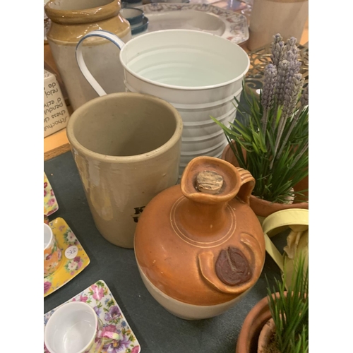 205 - THREE WATERING CANS AND PLANT POTS WITH FAUX LAVENDER