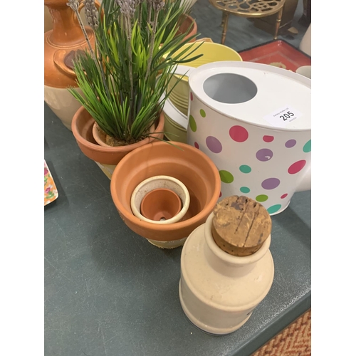 205 - THREE WATERING CANS AND PLANT POTS WITH FAUX LAVENDER