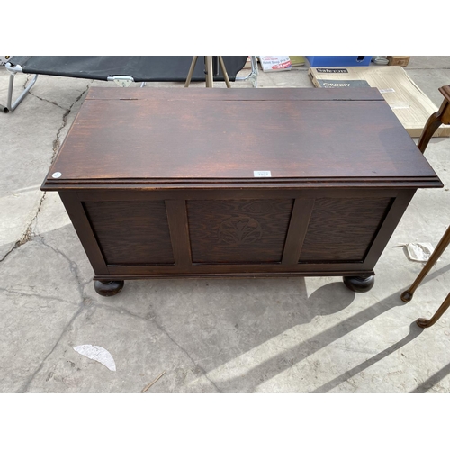 1927 - AN OAK BLANKET CHEST WITH PANELED FRONT