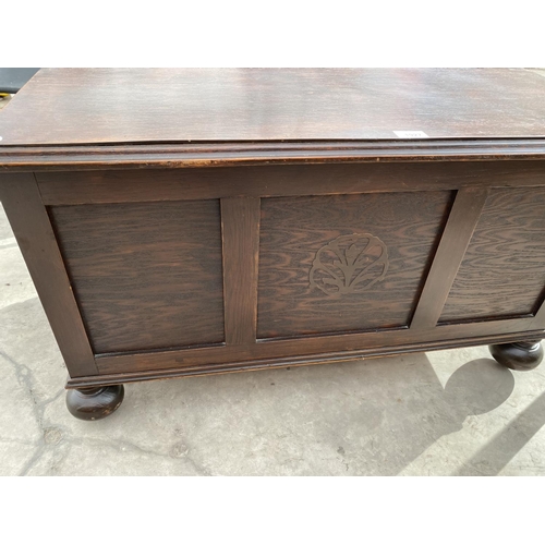 1927 - AN OAK BLANKET CHEST WITH PANELED FRONT