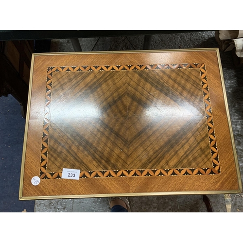 233 - A TWO DRAWER TABLE, INLAID WITH BRASS ACCESSORIES