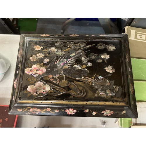 828 - A BLACK LACQUER FITTED STATIONARY BOX WITH FLOWER AND BIRD DECORATION