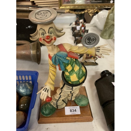 834 - TWO CLOWN FIGURINES AND BOX OF NINE ORNAMENTAL EGGS