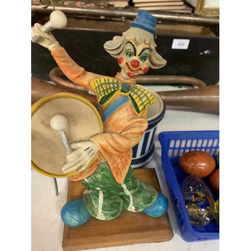 834 - TWO CLOWN FIGURINES AND BOX OF NINE ORNAMENTAL EGGS