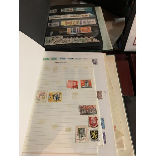 858 - TWO ALBUMS CONTAINING A LARGE QUANTITY OF STAMPS