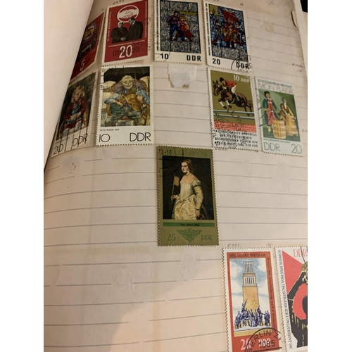 858 - TWO ALBUMS CONTAINING A LARGE QUANTITY OF STAMPS