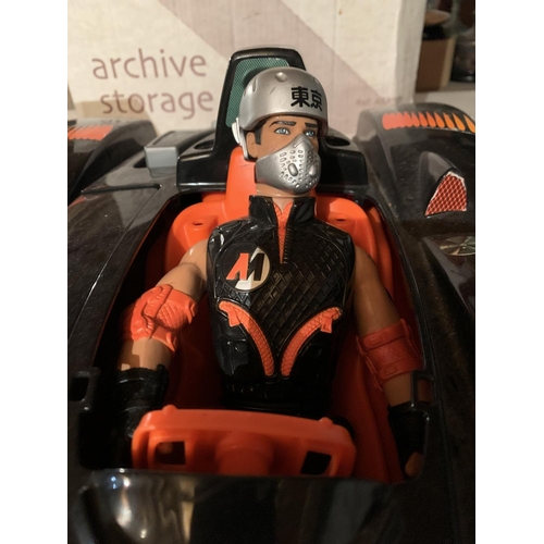 877 - A LARGE ACTION MAN SPORTS CAR WITH DRIVER