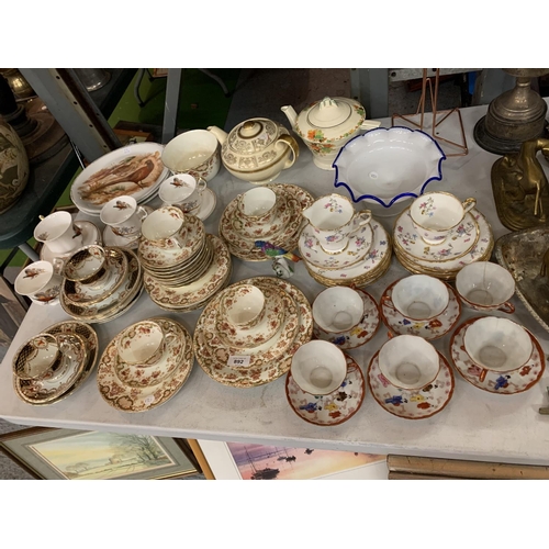 892 - A LARGE SELECTION OF CHINA TEA SETS TO INCLUDE TWO TEAPOTS (SOME A/F)