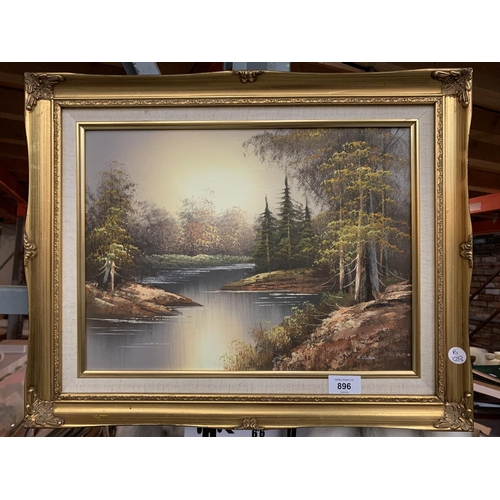 896 - A GILT FRAMED PRINT OF A RIVER IN A FOREST