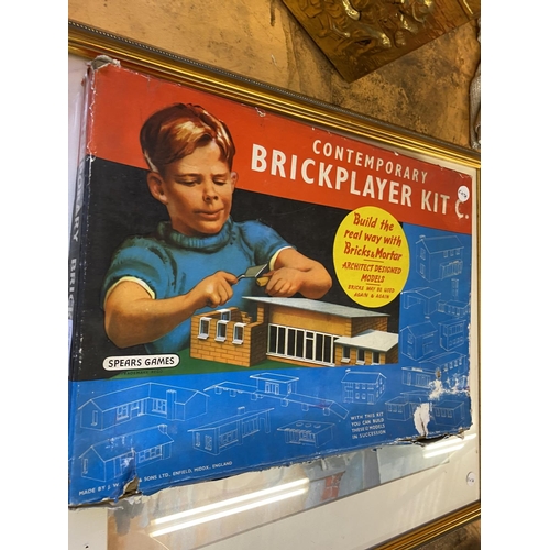 816 - A FRAMERD SEASIDE PRINT, A CHILD'S BRICKLAYER KIT AND A LARGE SQUARE RED GLASS PLATTER