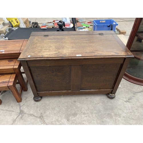 1929 - A PANELED OAK BLANKET CHEST