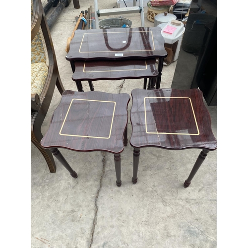 1933 - A MAHOGANY NEST OF FOUR TABLES