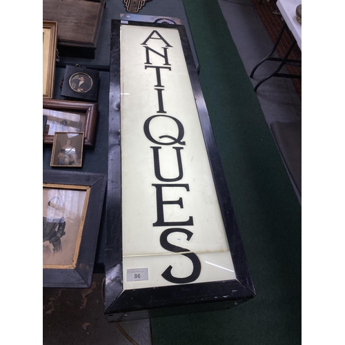 86 - A LARGE BLACK METAL LIGHT BOX SHOP SIGN 'ANTIQUES'