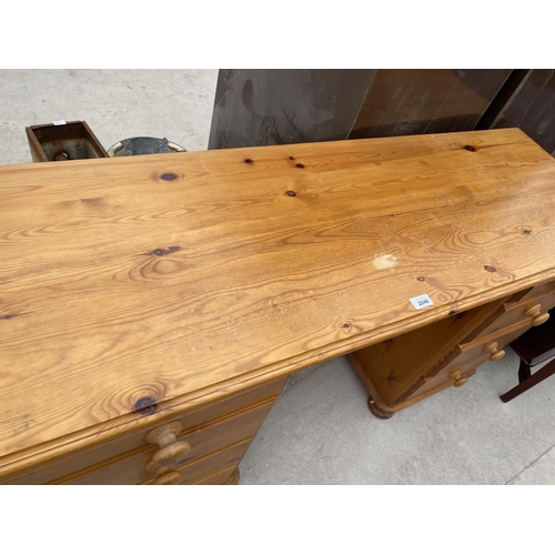 2048 - A PINE DESK WITH EIGHT DRAWERS