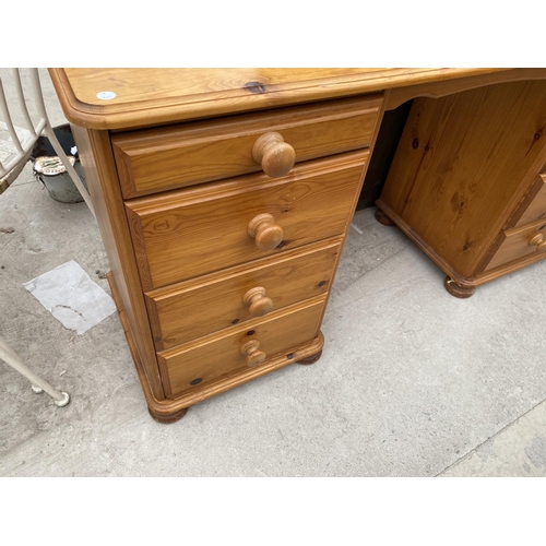 2048 - A PINE DESK WITH EIGHT DRAWERS