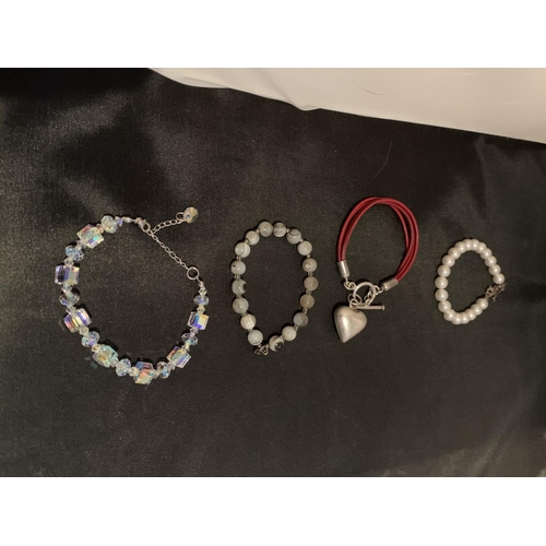 510 - FOUR SILVER CLASP BRACELETS