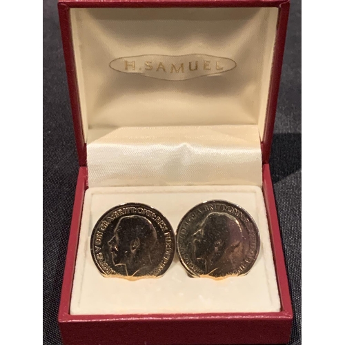 519 - A PAIR OF COIN CUFF LINKS