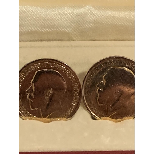 519 - A PAIR OF COIN CUFF LINKS