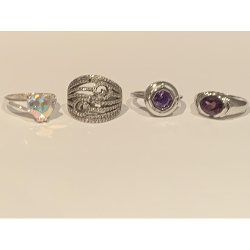 539 - FOUR VARIOUS SILVER RINGS