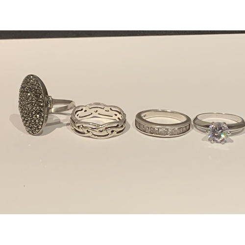 540 - FOUR VARIOUS SILVER RINGS