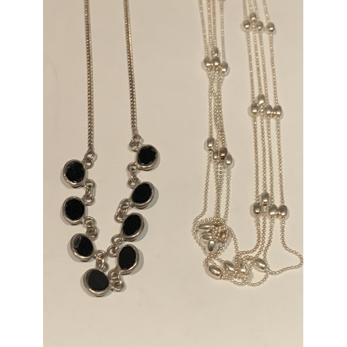 563 - FOUR VARIOUS SILVER NECKLACES