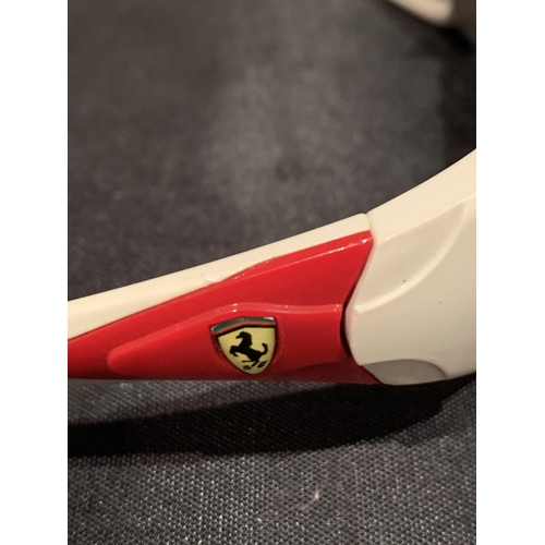 573 - A PAIR OF FERRARI SUNGLASSES