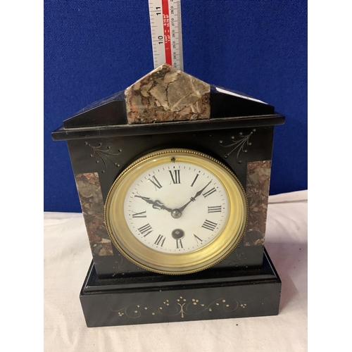 17 - A POLISHED SLATE AND MARBLE VICTORIAN MANTLE CLOCK WITH BRASS DETAIL AND KEY