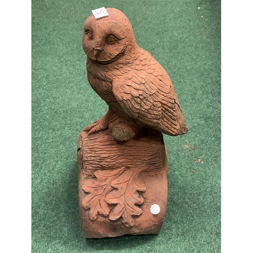 30 - A TERRACOTTA ROOF FINIAL WITH OWL DETAIL