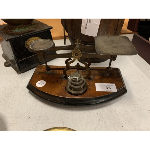 35 - A TRIO OF VINTAGE WOODEN AND BRASS WARETO INCLUDE A BRANDY BARREL AND COFFEE GRINDER