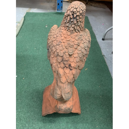 36 - A TERRACOTTA BIRD OF PREY ROOF FINIAL