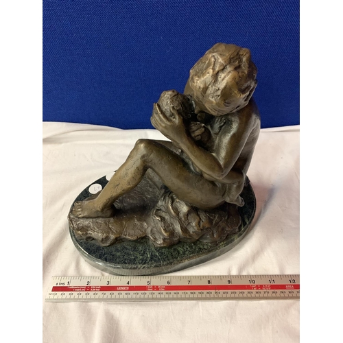 37A - A BRONZE FIGURINE OF A MOTHER AND CHILD SIGNED RUBIN