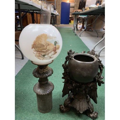 58 - A BRONZE OIL LAMP WITH DECORATIVE DETAIL OF AN EAGLE AND AN ORNATE GLASS SHADE AND FUNNEL