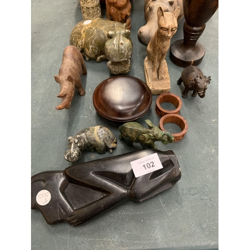 102 - A SELECTION OF WOODEN AND POTTERY ITEMS TO INCLUDE CARVED ANIMALS