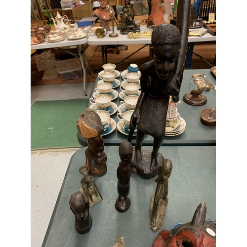 103 - AN ASSORTMENT OF CARVED ITEMS TO INCLUDE AFRICAN FIGURINES ETC