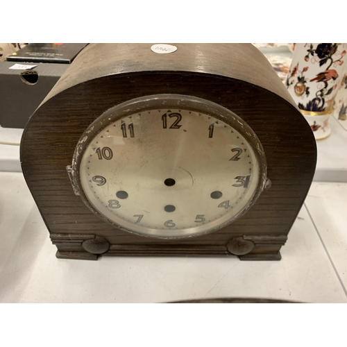 131 - A SELECTION OF THREE WOODEN MANTEL CLOCKS WITH WEIGHTS