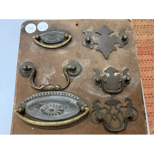 136 - A VINTAGE IRONMONGERY DISPLAY BOARD FOR BRASS SAMPLES