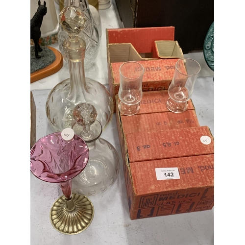 142 - A SELECTION OF MID CENTURY MEDICI SHERRY AND LIQUEUR GLASSES WITH TWO DECANTERS AND A CRANBERRY GLAS... 