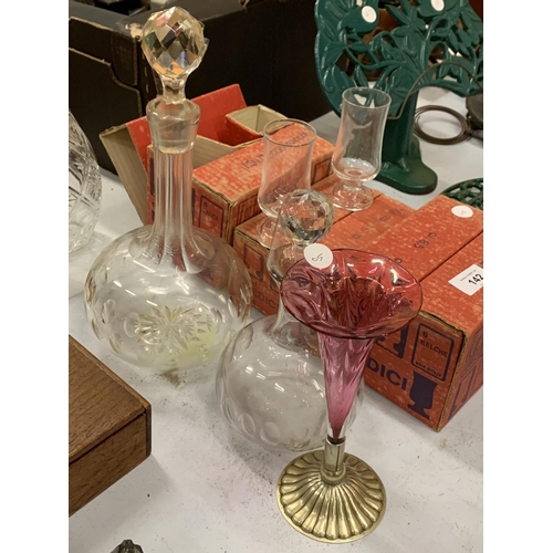 142 - A SELECTION OF MID CENTURY MEDICI SHERRY AND LIQUEUR GLASSES WITH TWO DECANTERS AND A CRANBERRY GLAS... 