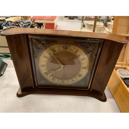 159 - THREE VINTAGE CLOCKS AND A BAROMETER TO INCLUDE A VINTAGE ALARM CLOCK WITH AN EMBROIDERED FACE