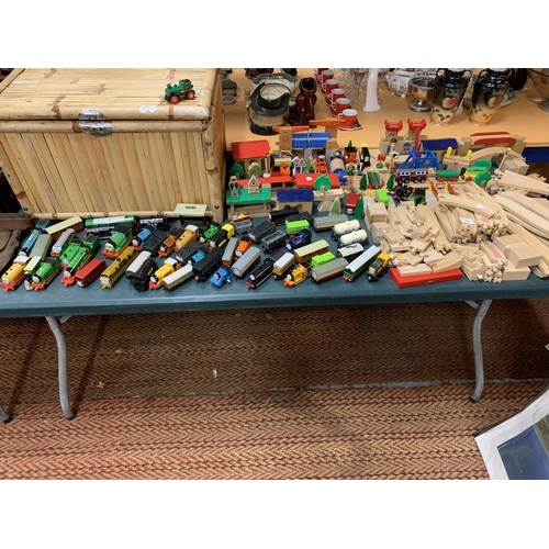 191 - A LARGE QUANTITY OF WOODEN TOY TRAIN TRACKS AND THOMAS THE TANK ENGINES TO INCLUDE A LARGE LIDDED BA... 