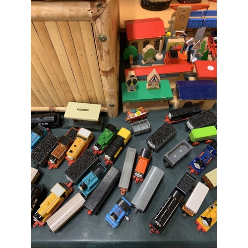 191 - A LARGE QUANTITY OF WOODEN TOY TRAIN TRACKS AND THOMAS THE TANK ENGINES TO INCLUDE A LARGE LIDDED BA... 