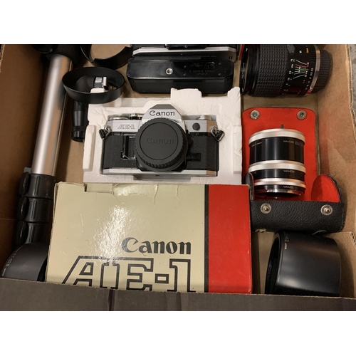 210 - A BOX CONTAINING TWO CANON CAMERAS, VARIOUS LENSES AND A TRIPOD