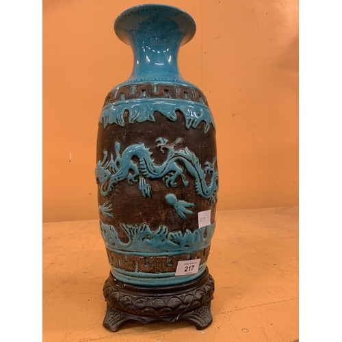 217 - A LARGE TURQUOISE VASE WITH RELIEF MOULDED DRAGON DESIGN, UNMARKED TO BASE