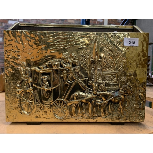 218 - A BRASS MAGAZINE RACK WITH COACHING SCENE DEPICTED