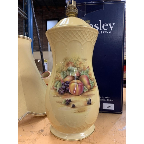 223 - AN AYNSLEY FRUIT DECORTED TABLE LAMP AND SHADE