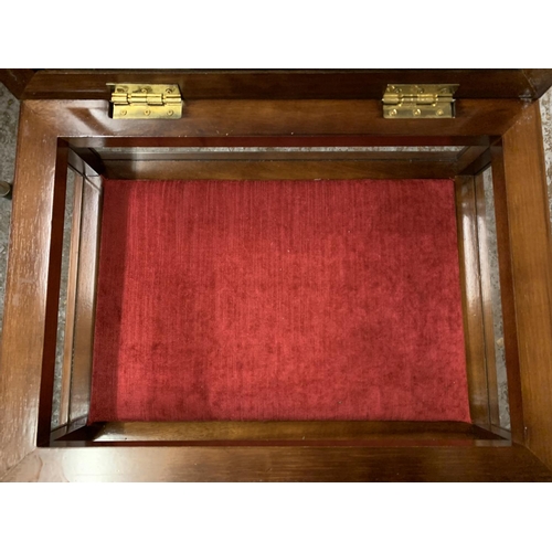 229 - A MAHOGANY FOUR LEGGED DISPLAY CABINET