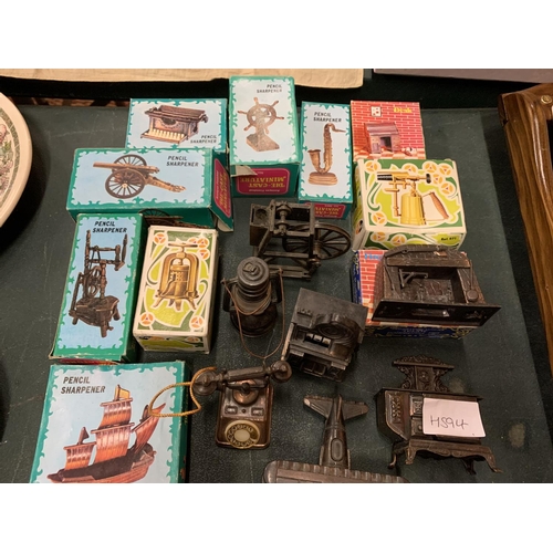 233 - A LARGE COLLECTION OF SPELTER PENCIL SHARPENERS IN VARIOUS INTERESTING SHAPES TO INCLUDE A HARP, TEL... 